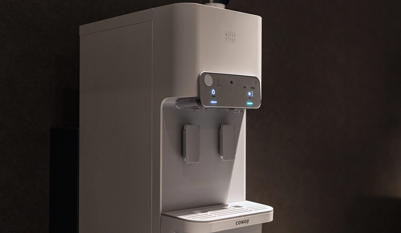 A stylishly designed water dispenser is installed.